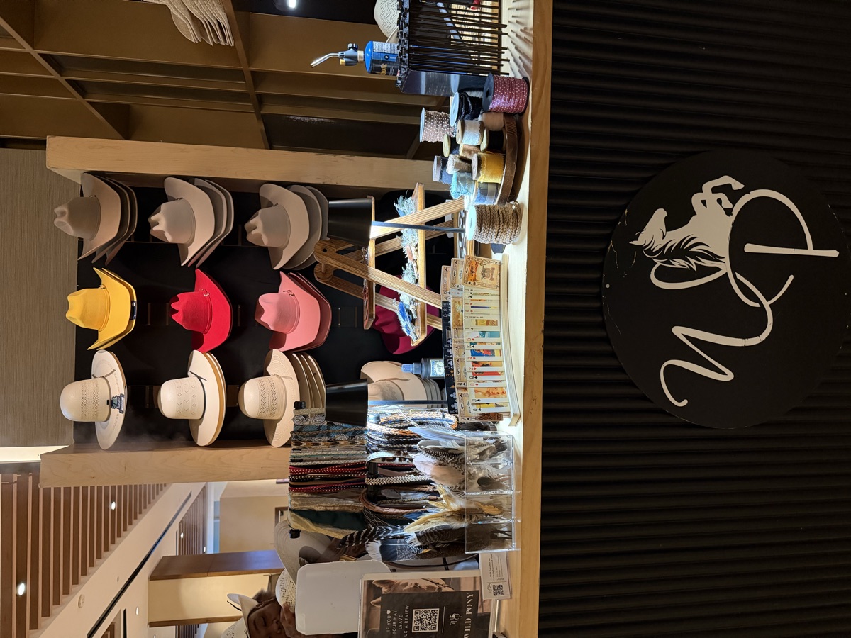 Wild Pony branded hat bar booth set up at a corporate event