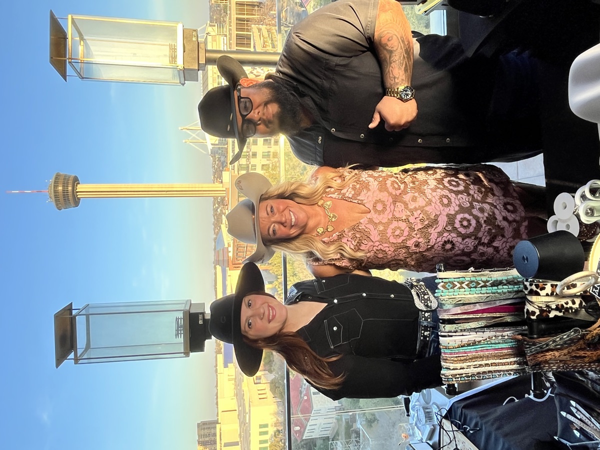 Wild Pony team with custom hats and the San Antonio skyline